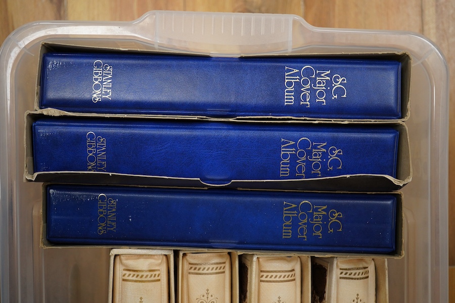 A box containing eight modern stamp albums